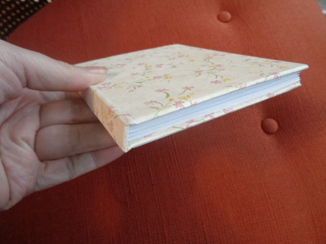 Small hardcover journal covered in wallpaper