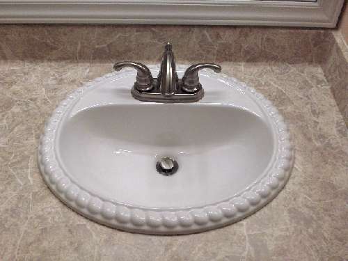 Bathroom countertop resurfaced with PaperIllusion Florentine Marble Stone
