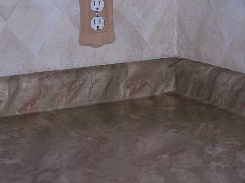 Bathroom countertop resurfaced with PaperIllusion Travertine Green and Red