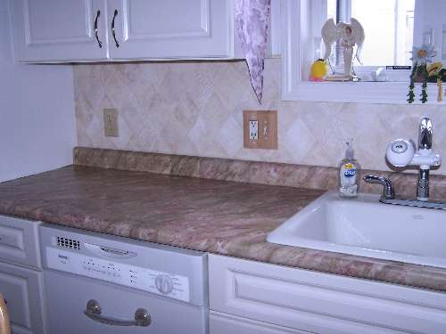 Bathroom countertop resurfaced with PaperIllusion Travertine Green and Red