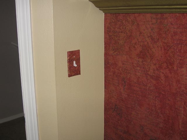 Switchplate covered with PaperIllusion Script Tuscan Red